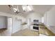 Bright kitchen features stainless appliances, stone countertops and light wood-look flooring at 2357 Wellborn Hills Pl, Lithonia, GA 30058