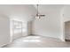 Spacious living room with vaulted ceilings and ample natural light at 2357 Wellborn Hills Pl, Lithonia, GA 30058
