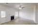 Light and bright living room boasts modern fireplace, light gray walls, and updated flooring at 2357 Wellborn Hills Pl, Lithonia, GA 30058