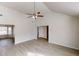 Open-concept living room with vaulted ceilings and light wood floors at 2357 Wellborn Hills Pl, Lithonia, GA 30058