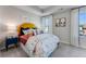 Decorated and staged bedroom with gray carpet and window letting in plenty of natural light at 5834 Schelton Se Pl, Mableton, GA 30126