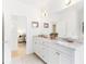 Bright bathroom featuring a marble countertop, double vanity, and a connecting bedroom at 416 Glen Iris Ne Dr, Atlanta, GA 30308