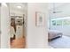 Bedroom view including walk-in closet with custom shelving and hanging space for optimal organization at 416 Glen Iris Ne Dr, Atlanta, GA 30308