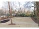 A newly-sodded backyard with mature trees provides shade and a serene backdrop at 496 Federal Se Ter, Atlanta, GA 30315