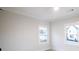 Bright bedroom with natural light from two windows, showcasing neutral walls and classic trim details at 496 Federal Se Ter, Atlanta, GA 30315