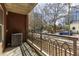 The balcony has an iron railing and faces a street lined with trees and city buildings at 1101 Juniper St # 61, Atlanta, GA 30309