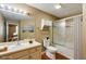 Neutral bathroom features a vanity, shower/tub combo, and natural light at 1101 Juniper St # 61, Atlanta, GA 30309