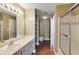 Bright bathroom with vanity, shower, walk in closet, and an open view of the toilet at 1101 Juniper St # 61, Atlanta, GA 30309
