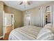Comfortable bedroom features neutral tones, ceiling fan, and closet access at 1101 Juniper St # 61, Atlanta, GA 30309