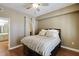 Cozy bedroom with hardwood floors, plantation shutters, and attached bathroom and closet at 1101 Juniper St # 61, Atlanta, GA 30309