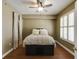 Bedroom featuring a ceiling fan, plantation shutters, and a bed with unique drawers at 1101 Juniper St # 61, Atlanta, GA 30309