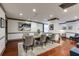 Bright dining room with hardwood floors, a modern rug, and stylish gray chairs at 1101 Juniper St # 61, Atlanta, GA 30309