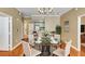 Dining room featuring a glass table, chair seating, and a partial kitchen view at 1101 Juniper St # 61, Atlanta, GA 30309