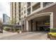 Elegant condo entrance featuring a covered walkway and convenient parking access at 1101 Juniper St # 61, Atlanta, GA 30309