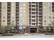 A striking condominium building with a grand entrance and multiple balconies at 1101 Juniper St # 61, Atlanta, GA 30309