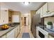 Updated kitchen featuring stainless steel appliances, and tile flooring at 1101 Juniper St # 61, Atlanta, GA 30309