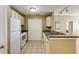 A kitchen with stainless steel sink, white appliances and practical design at 1101 Juniper St # 61, Atlanta, GA 30309