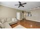 Spacious living area with hardwood floors, sectional couch, and partial kitchen view at 1101 Juniper St # 61, Atlanta, GA 30309