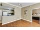 Spacious living room with kitchen view, hardwood floors and ample natural light at 1101 Juniper St # 61, Atlanta, GA 30309