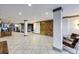 A spacious lobby with a tile floor has stylish lounge furniture and a brass-colored elevator at 1101 Juniper St # 61, Atlanta, GA 30309