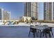 Large rooftop deck offering comfortable seating and stunning city views at 1101 Juniper St # 61, Atlanta, GA 30309