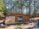 Weathered single-story house shows a window-mounted AC unit and aging exterior at 3150 Old Van Wert Rd, Villa Rica, GA 30180