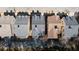Aerial shot of rooftops showing solar panels, and tree-lined streets at 3780 Baxley Pine Trl, Suwanee, GA 30024