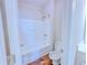 A bathroom with a white toilet and a white shower and tub combination at 3780 Baxley Pine Trl, Suwanee, GA 30024