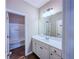 Bright bathroom with white vanity, large mirror, and a separate toilet and shower area at 3780 Baxley Pine Trl, Suwanee, GA 30024