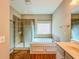 Bright bathroom featuring a walk-in shower, a soaking tub, and wood-look flooring at 3780 Baxley Pine Trl, Suwanee, GA 30024