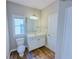 Bathroom features a white vanity, large mirror and an open window at 3780 Baxley Pine Trl, Suwanee, GA 30024