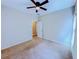 A spacious bedroom featuring a ceiling fan and neutral color scheme at 3780 Baxley Pine Trl, Suwanee, GA 30024