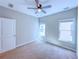 Bedroom with two windows and standard ceiling fan at 3780 Baxley Pine Trl, Suwanee, GA 30024