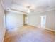 A large bedroom with a tray ceiling and ceiling fan at 3780 Baxley Pine Trl, Suwanee, GA 30024