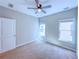 A well-lit bedroom with windows and a ceiling fan at 3780 Baxley Pine Trl, Suwanee, GA 30024