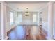 Formal dining room with wood floors, natural light, decorative columns, and stylish trim at 3780 Baxley Pine Trl, Suwanee, GA 30024