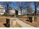 An inviting view with a stone walkway, showcasing the manicured lawn and beautiful exterior of the property at 3780 Baxley Pine Trl, Suwanee, GA 30024
