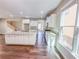 Modern eat-in kitchen with stainless steel appliances, granite countertops and wood floors at 3780 Baxley Pine Trl, Suwanee, GA 30024