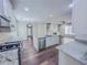 Modern kitchen featuring granite countertops, stainless steel appliances, and an island with a sink at 3780 Baxley Pine Trl, Suwanee, GA 30024