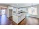 Beautiful kitchen with white cabinetry, granite countertops, a central island, and stainless steel appliances at 3780 Baxley Pine Trl, Suwanee, GA 30024