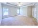 Spacious main bedroom features a trey ceiling and two windows at 3780 Baxley Pine Trl, Suwanee, GA 30024