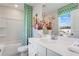 Well-lit bathroom with white vanity, sleek fixtures, and a modern shower/tub offers a serene space at 5845 Schelton Se Pl, Mableton, GA 30126