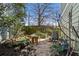 Serene backyard garden featuring a small stone pathway, natural stones, and a wooden bench at 735 Ponce De Leon Ne Pl, Atlanta, GA 30306