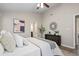 Comfortable bedroom with neutral walls, ceiling fan, and doorway to bathroom at 735 Ponce De Leon Ne Pl, Atlanta, GA 30306