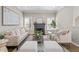 Cozy living room with fireplace, neutral tones, and hardwood floors at 735 Ponce De Leon Ne Pl, Atlanta, GA 30306