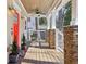 Cozy front porch with stone details and a bright red front door at 1892 Braeburn Se Cir, Atlanta, GA 30316