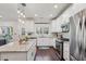 Bright kitchen featuring white cabinets, granite countertops, and stainless steel appliances at 1892 Braeburn Se Cir, Atlanta, GA 30316