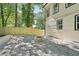 A backyard with stone firepit, fenced yard, and gravel covering at 2423 Melinda Ne Dr, Atlanta, GA 30345