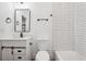 Tastefully designed bathroom with modern vanity, toilet, and tiled shower, showcasing a comfortable design at 2423 Melinda Ne Dr, Atlanta, GA 30345