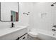Bathroom with white subway tile, matte black fixtures, and a quartz countertop vanity at 2423 Melinda Ne Dr, Atlanta, GA 30345